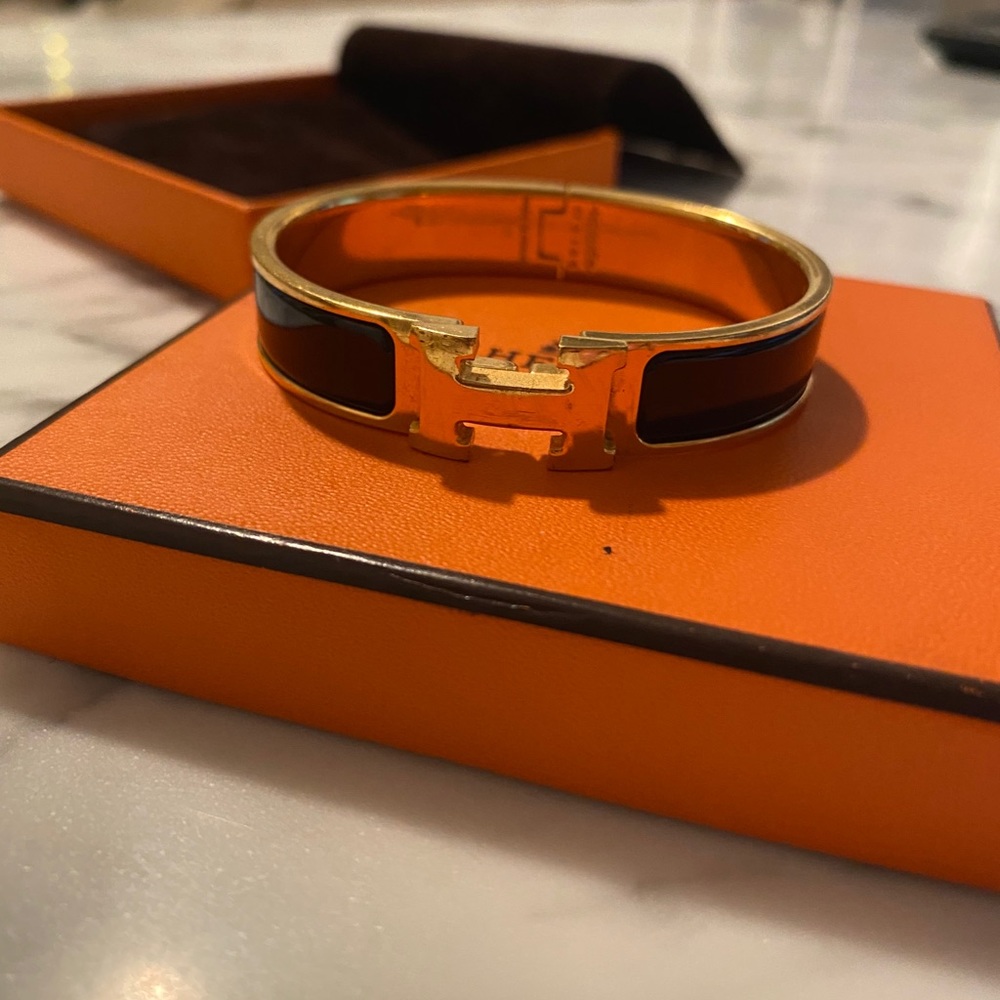 Hermès iconic black & gold Clic H bracelet